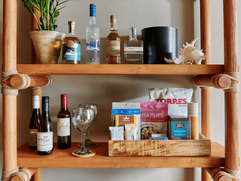 A shelf with food and wine
