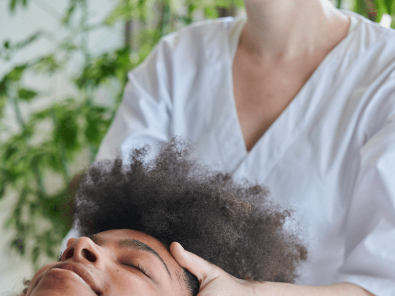 Person receiving a head massage