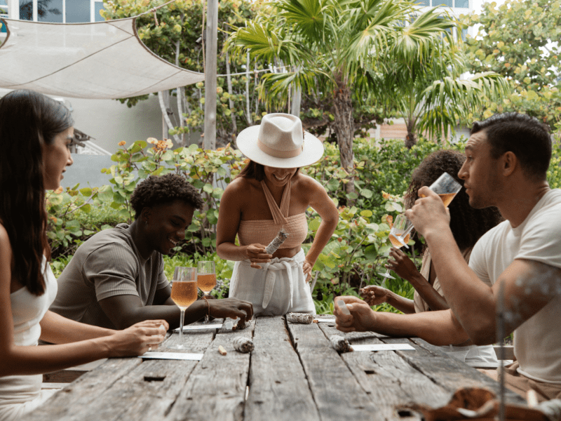 Group of people sipping wine