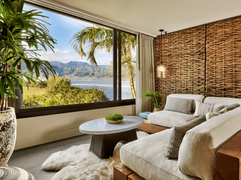 a room with large windows and a beach-view