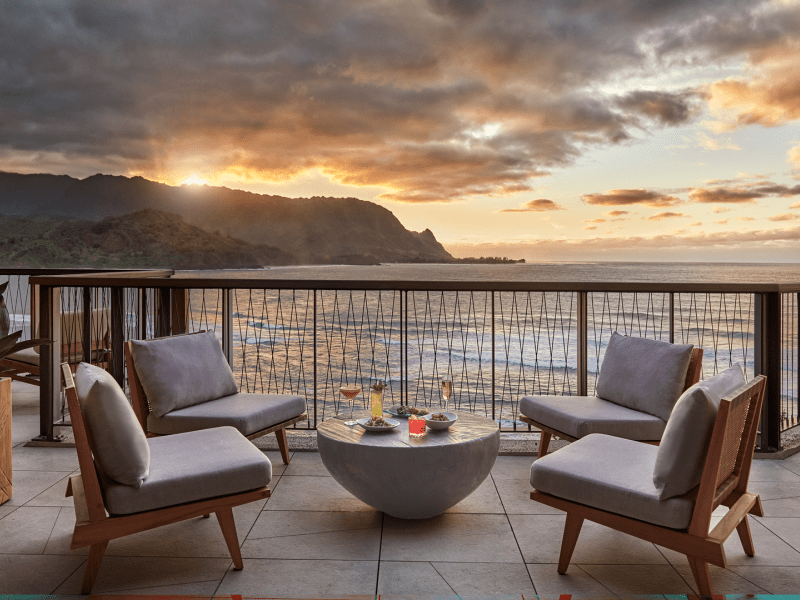 Lounge area on a deck overlooking the ocean at Welina Terrace