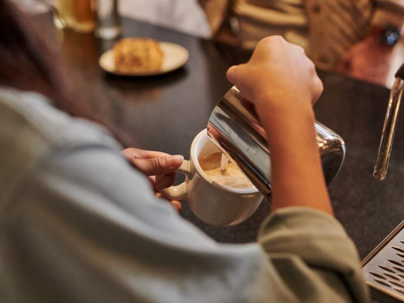 girl pouring coffee