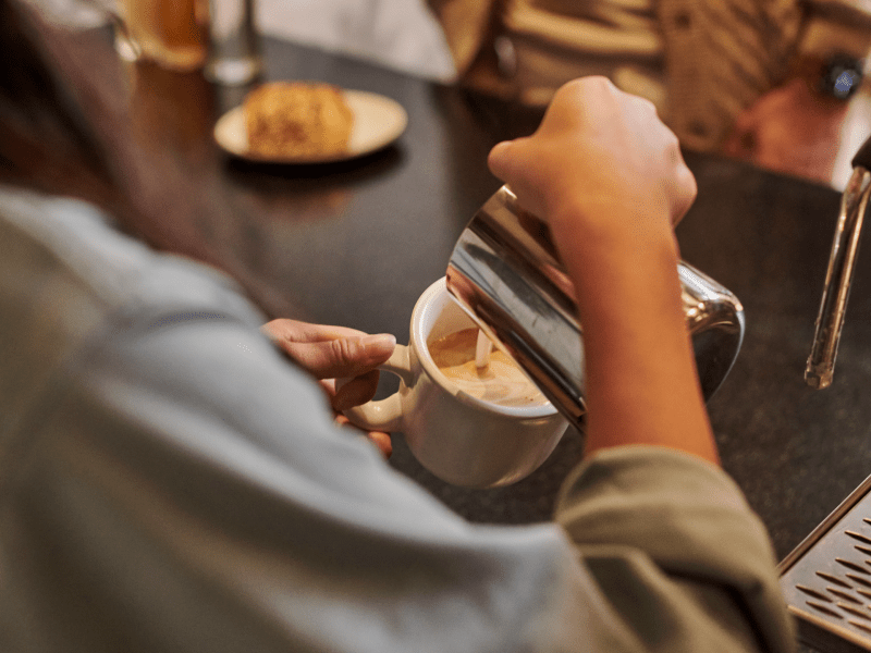 girl pouring coffee