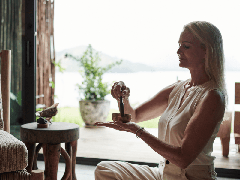 Woman with mini sound bowl