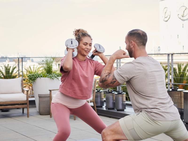 People working out at the 1 Hotel San Francisco rooftop