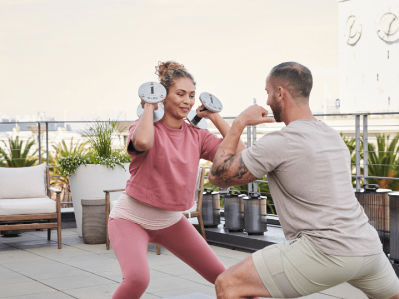 People working out at the 1 Hotel San Francisco rooftop