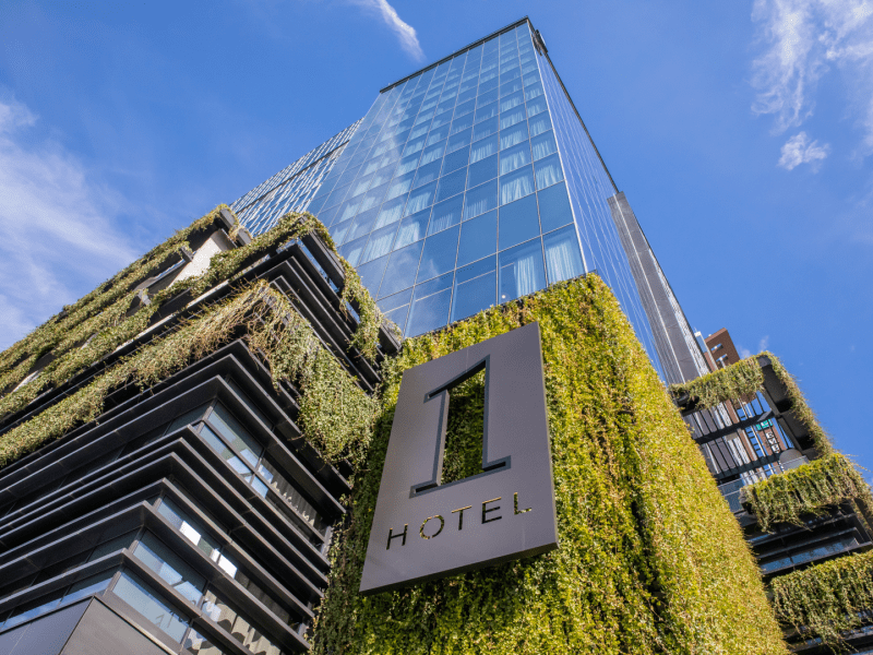 Looking up at 1 Hotel Nashville covered in plants