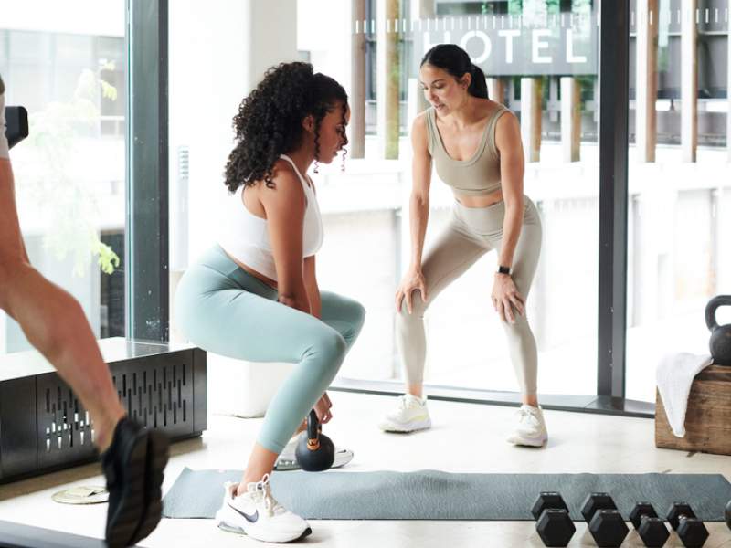 Woman and personal trainer