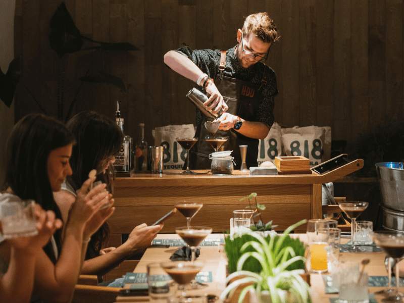 a person making a cocktail