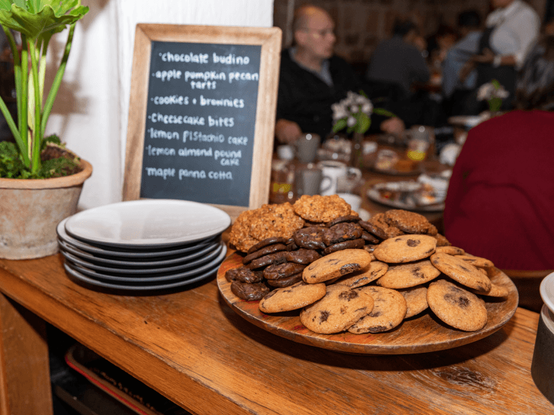 A stand with plates of cookies