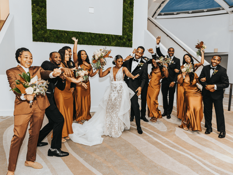 Wedding party dancing posing for a photo