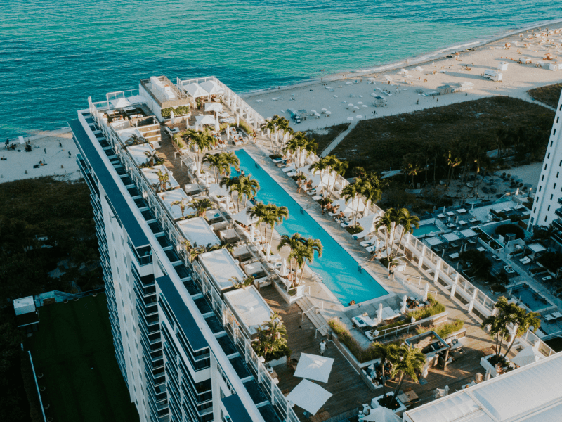 Birds eye view of the top of a building with a pool deck