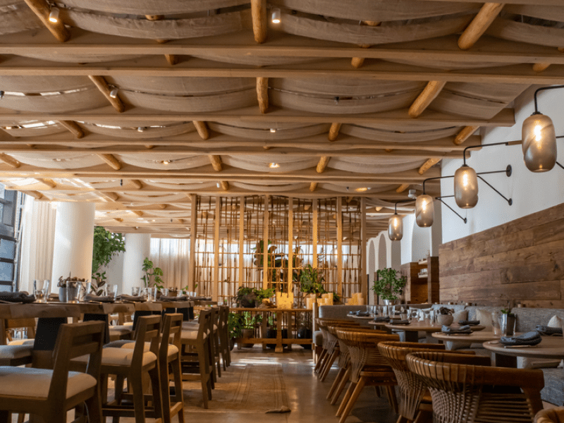 Rustic dining room area with a low hanging ceiling