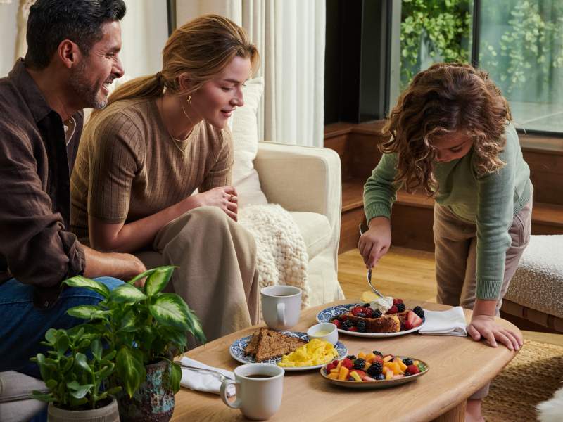 Family enjoying food at table