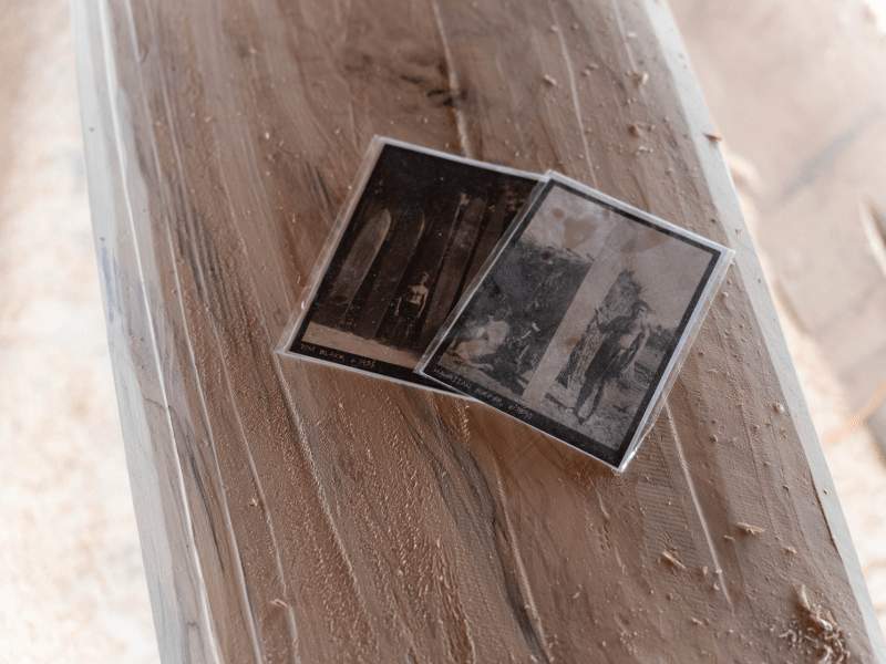 Two black and white photos of surfers
