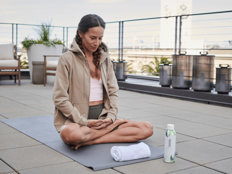 Woman doing yoga on the rooftop