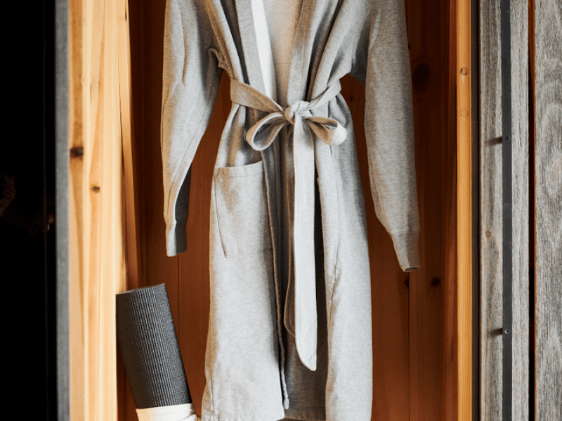 Grey housecoat hanging in a closet