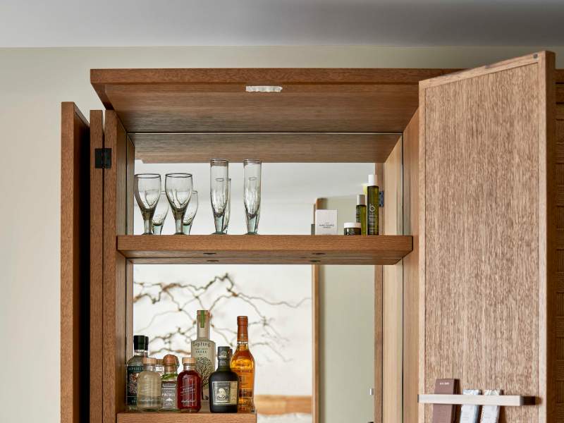 A 1Hotel mini bar featuring coffees and liquors.