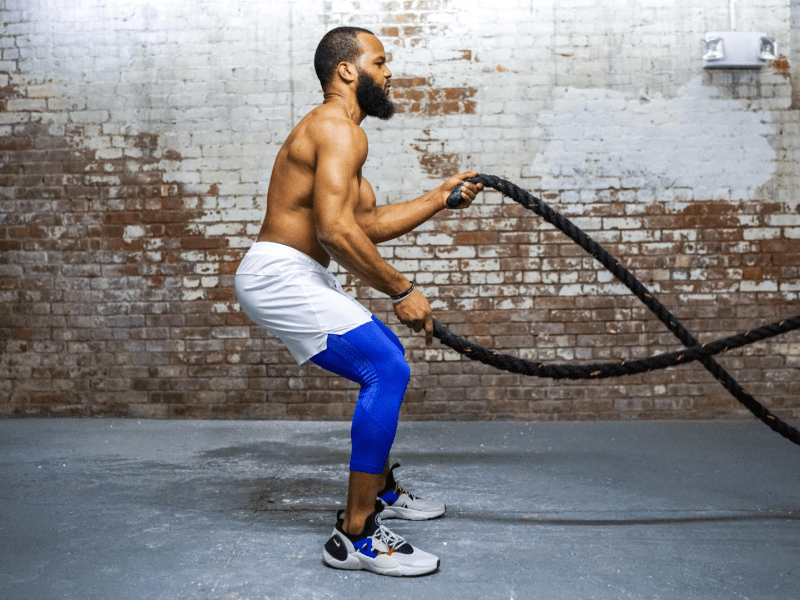 A person working out with ropes