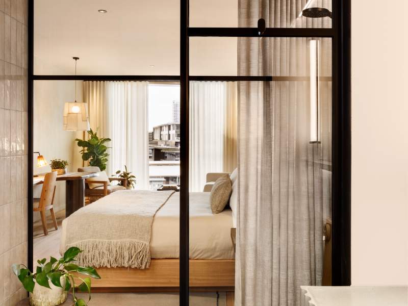 View of bedroom through glass wall