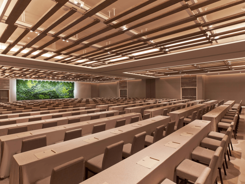 A large classroom with rows of tables