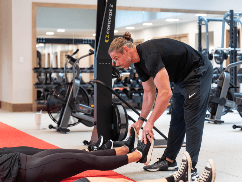 a person working out with their personal trainer