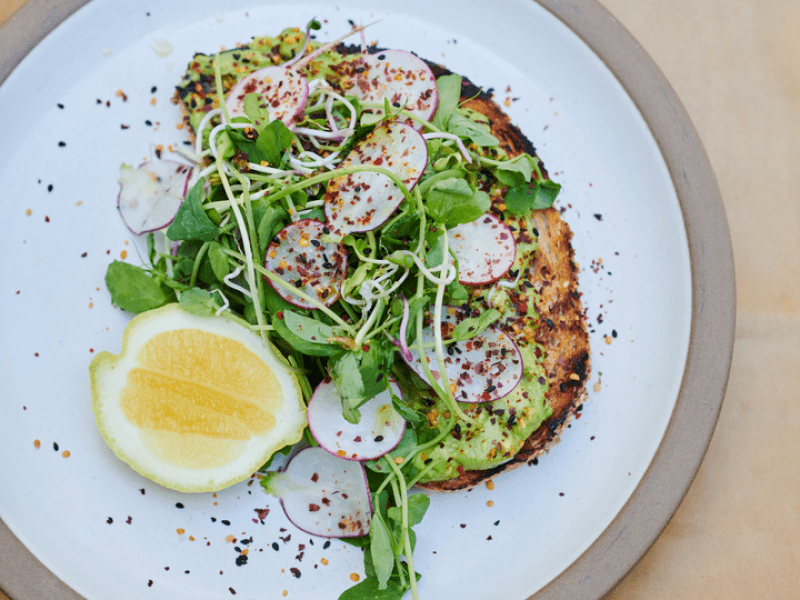 Avocado toast with a lemon slice