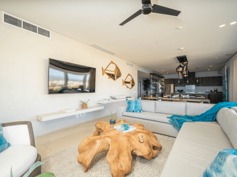 Living room with a wooden centerpiece and a sectional couch