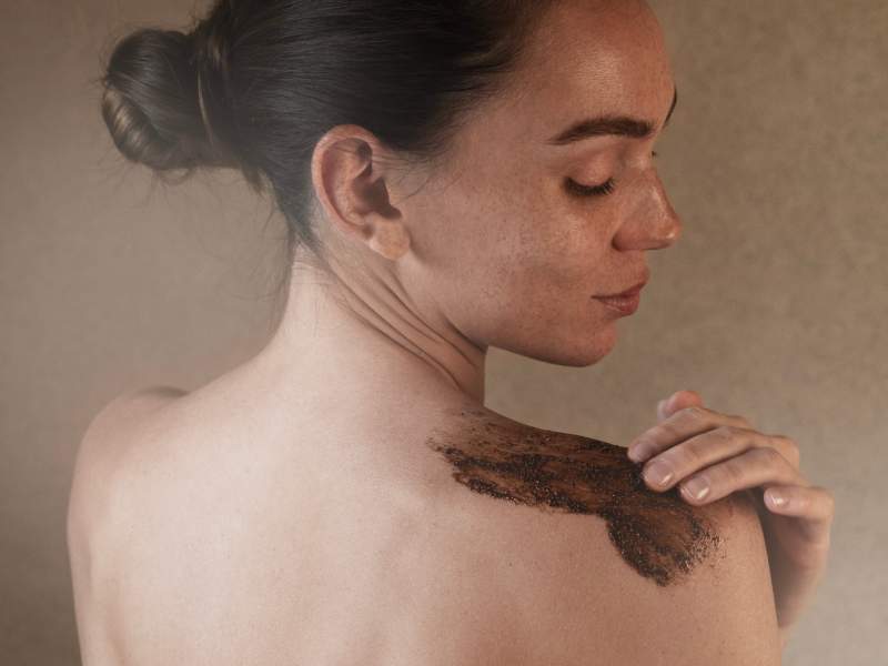 woman applying body product