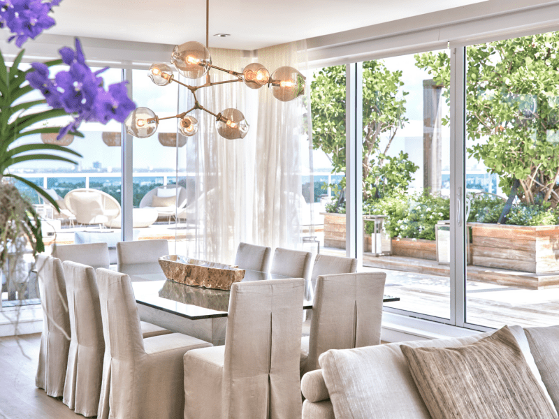 Dining table with an eccentric light fixture