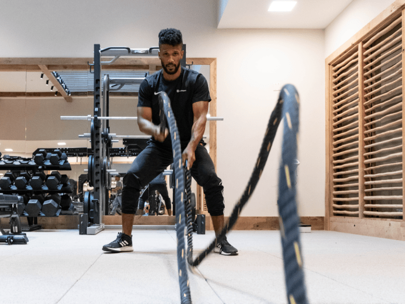 a man using ropes for exercise