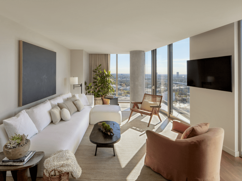 A living room area with a couch and chairs