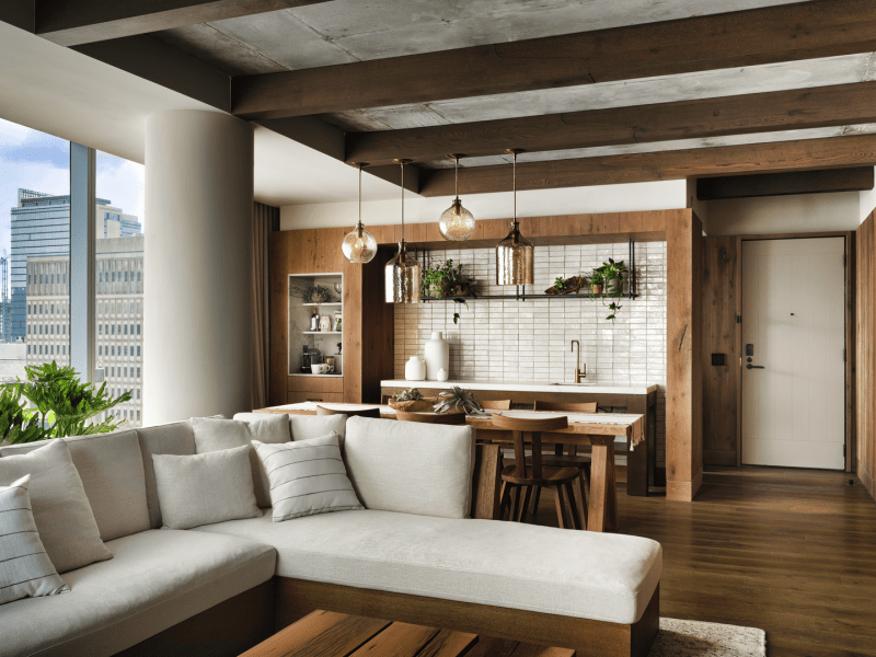 Sectional couch in a wood paneled room