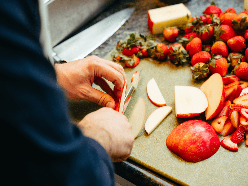 Person chopping apples