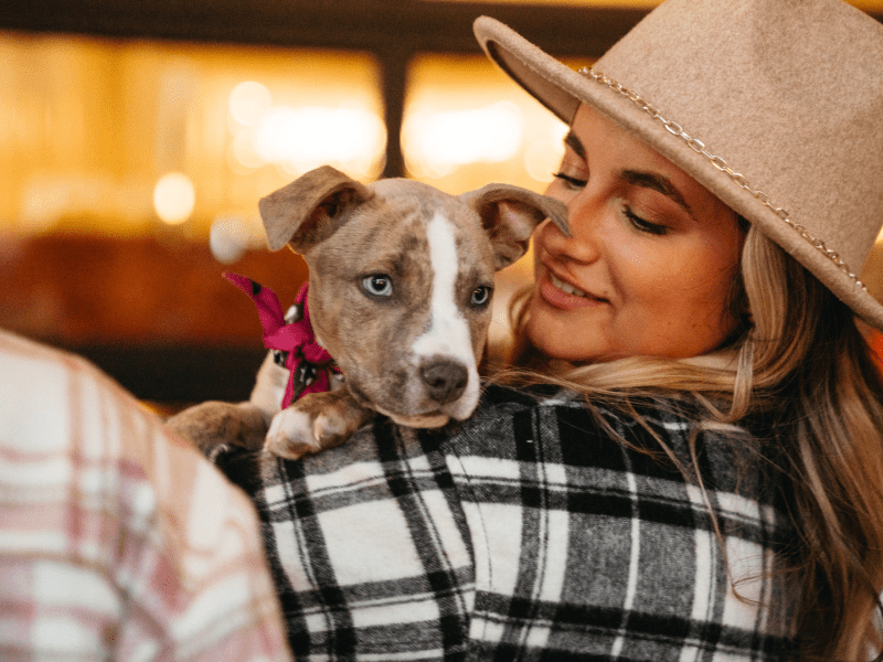 Woman holding a puppy