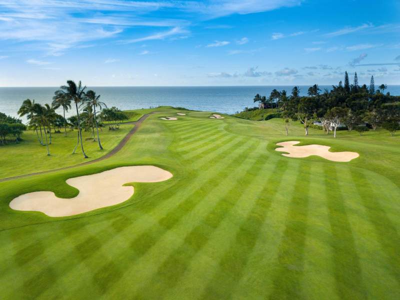 A golf green with sand pits