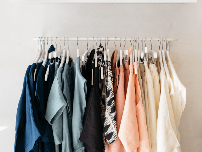 Clothes hanging in a closet