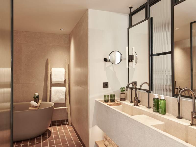 amenities, sink, and bath in warm-toned bathroom