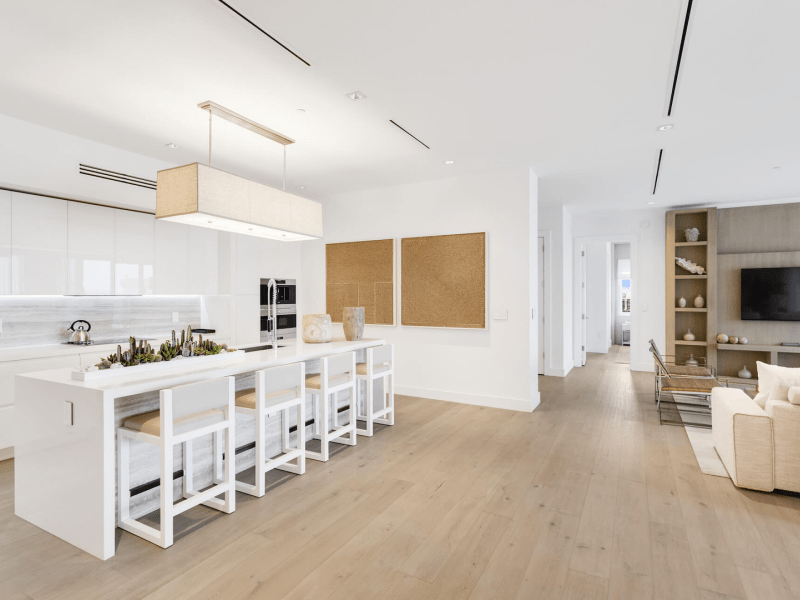 kitchen with island surrounded by high back stools