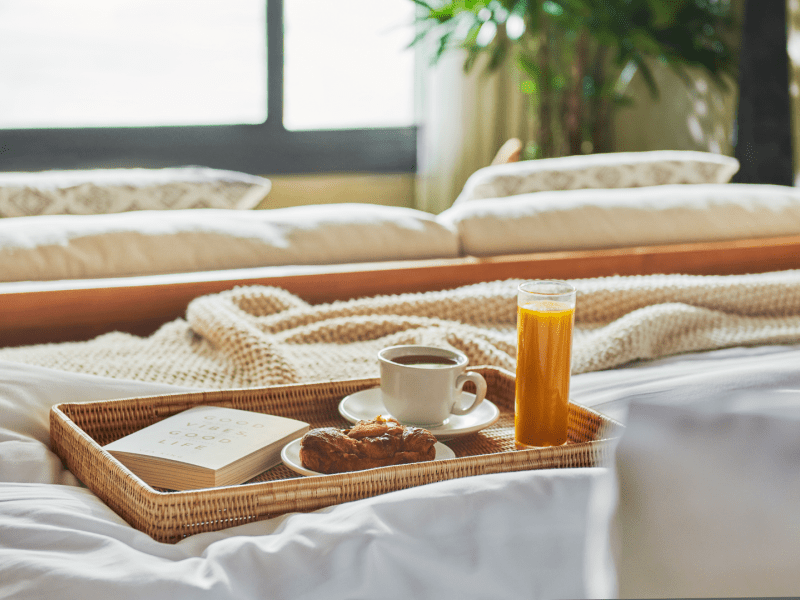 Tray of breakfast food in bed