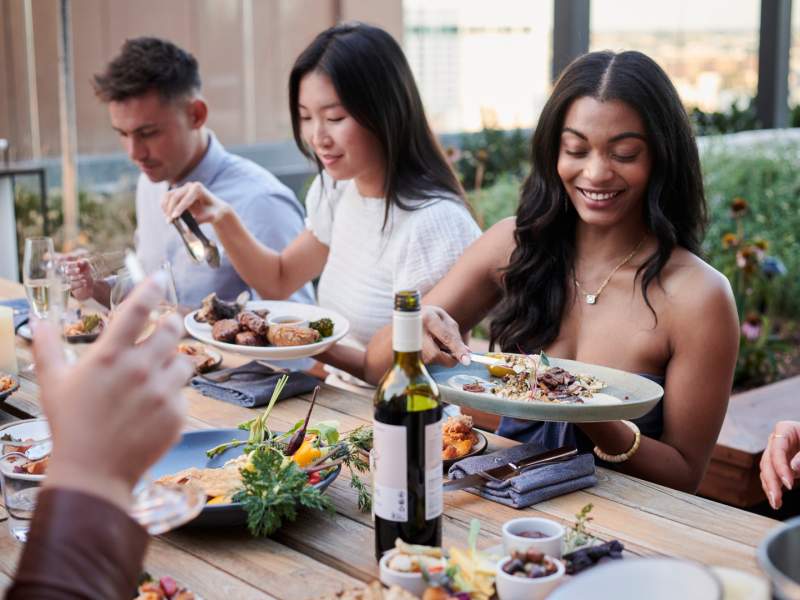 Group of people eating outdoors