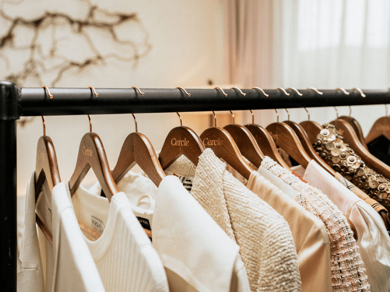 Fresh clothes on clothing hangers