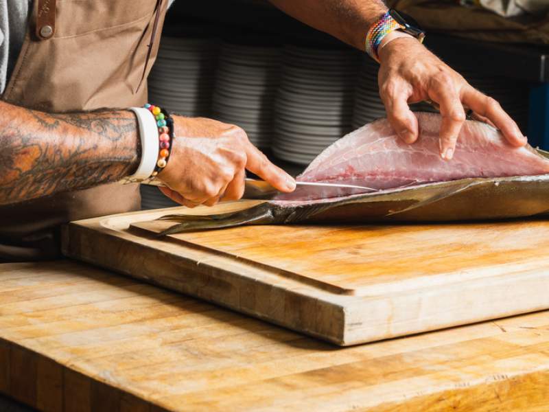 a chef preparing fish