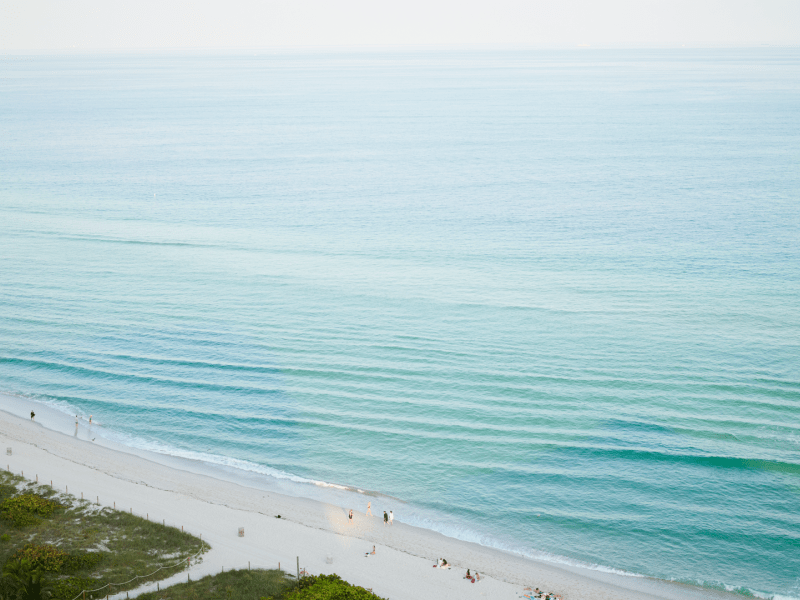 Birds eye view of a beach looking out to the ocean