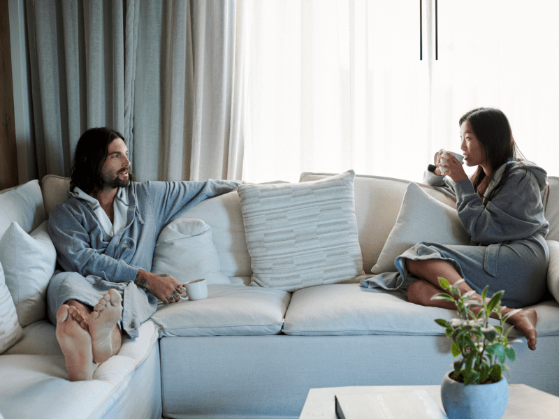 Two people relaxing on a couch