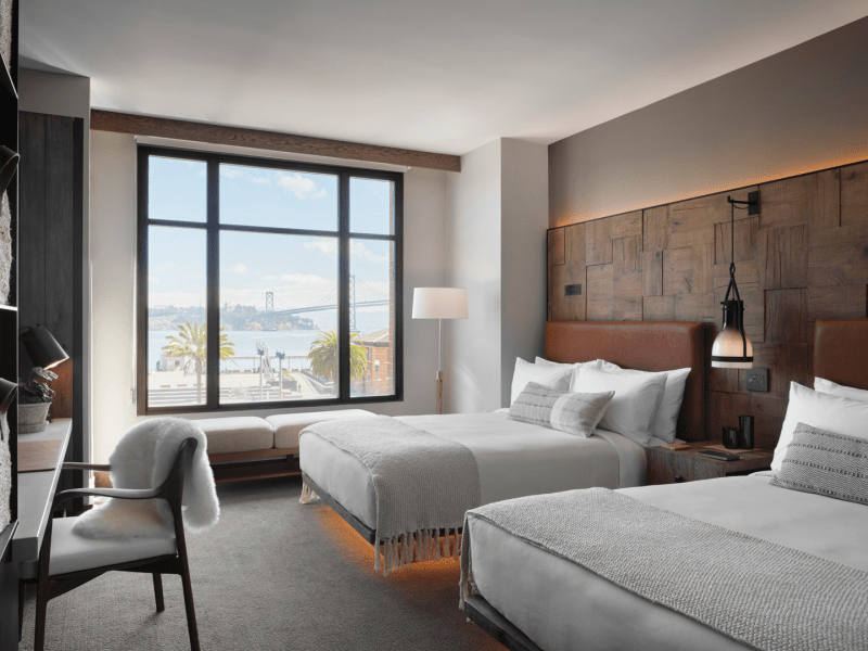 Two queen beds overlook the nearby waterfront