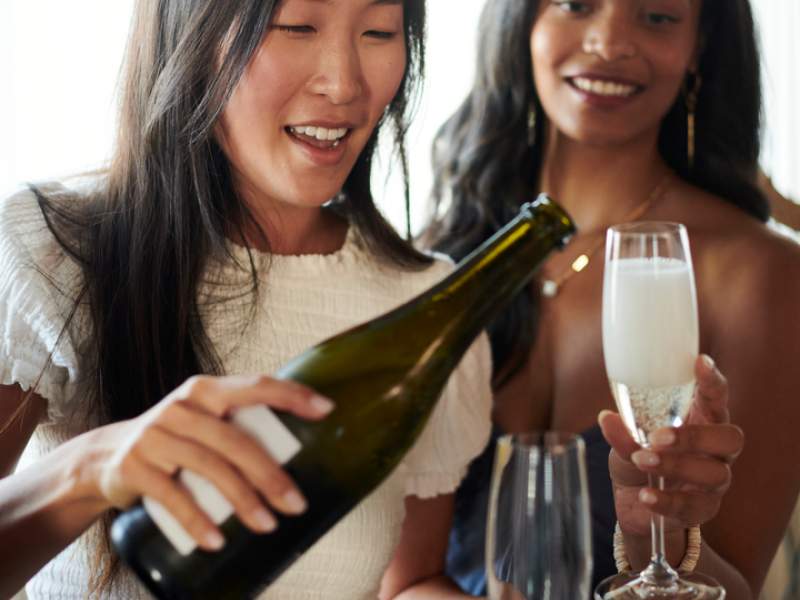 Women pouring champagne 