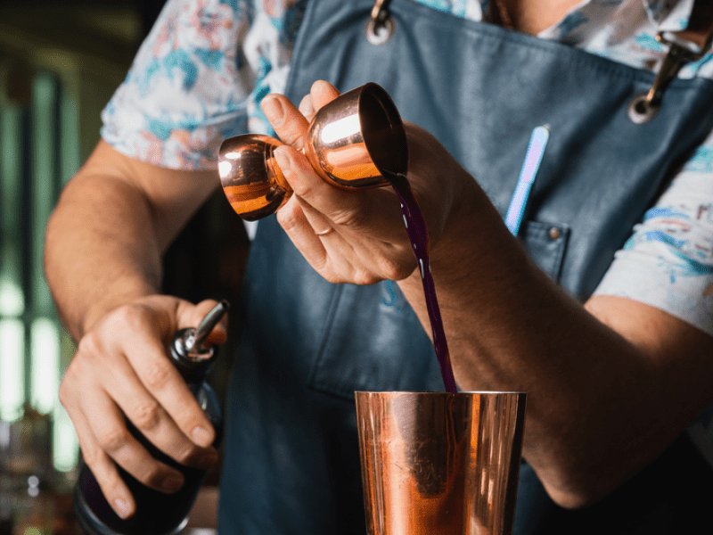 Steven Minor making a cocktail