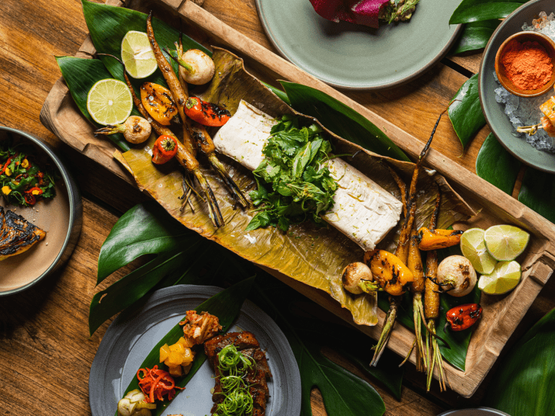 Charred vegetables on a board
