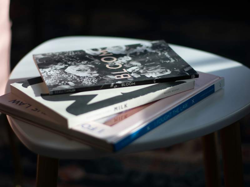 Books on white round table